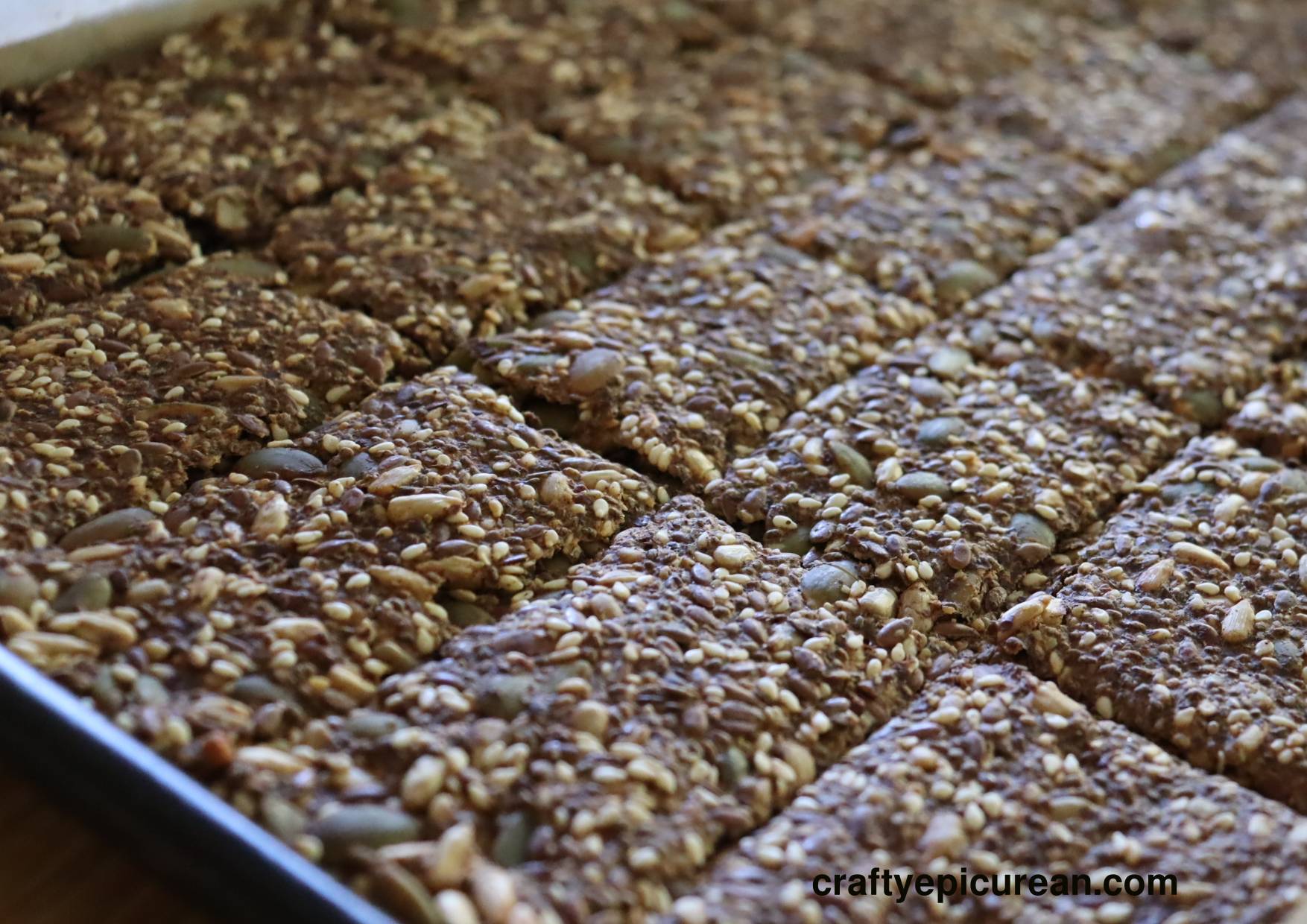 Baking tray full of freshly baked seed crackers
